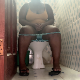 A big, black woman is recorded taking a shit while sitting on a toilet. Pooping sounds and soft plops are clearly heard. She wipes her ass with a product reveal at the end of the movie. Presented in 720P HD. About 8.5 minutes.